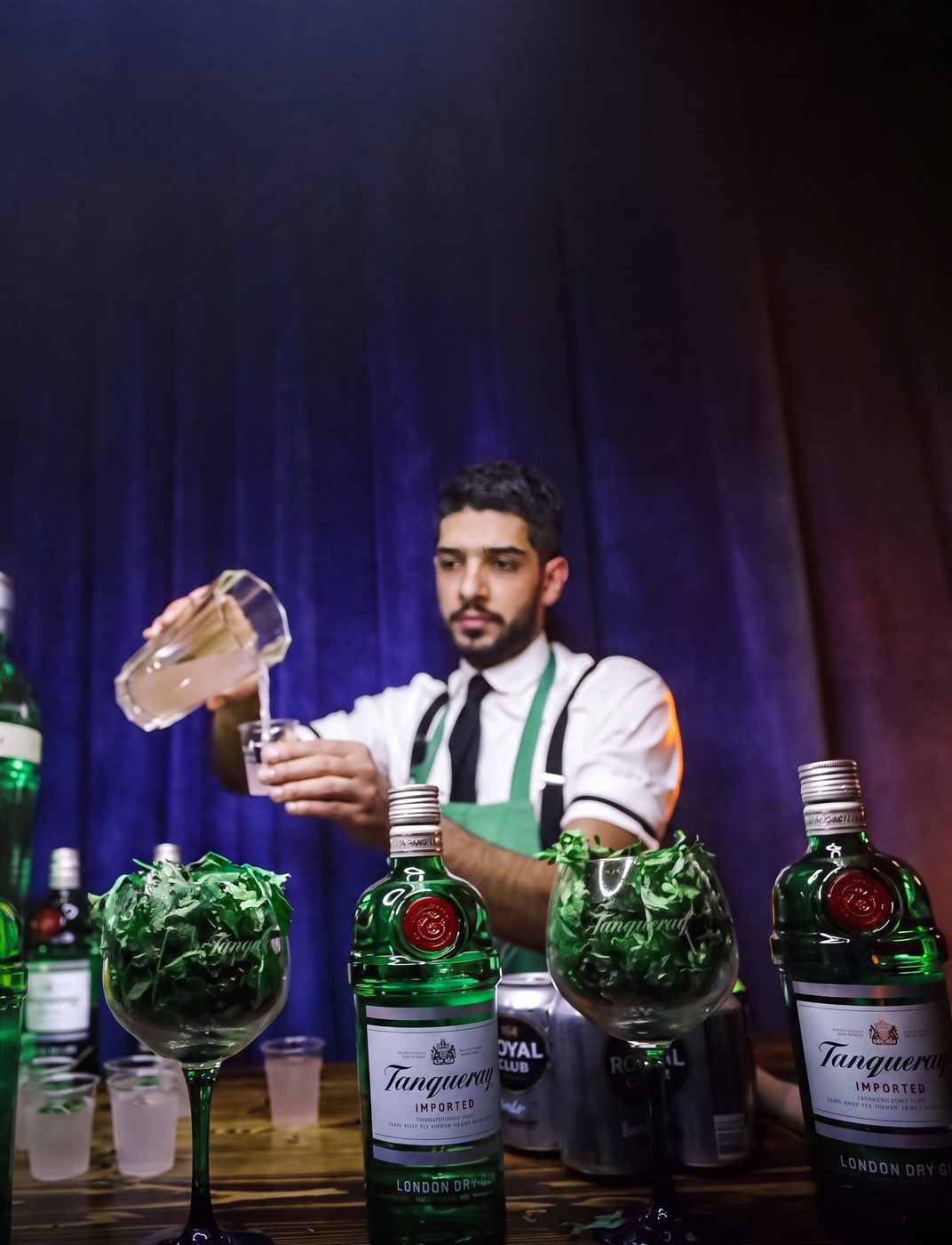 Gerrard Allam preparing cocktails with Tanqueray gin