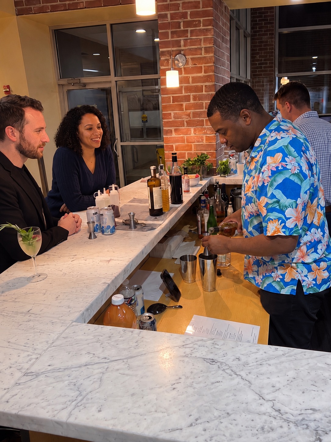 Maker building a cocktail at the station