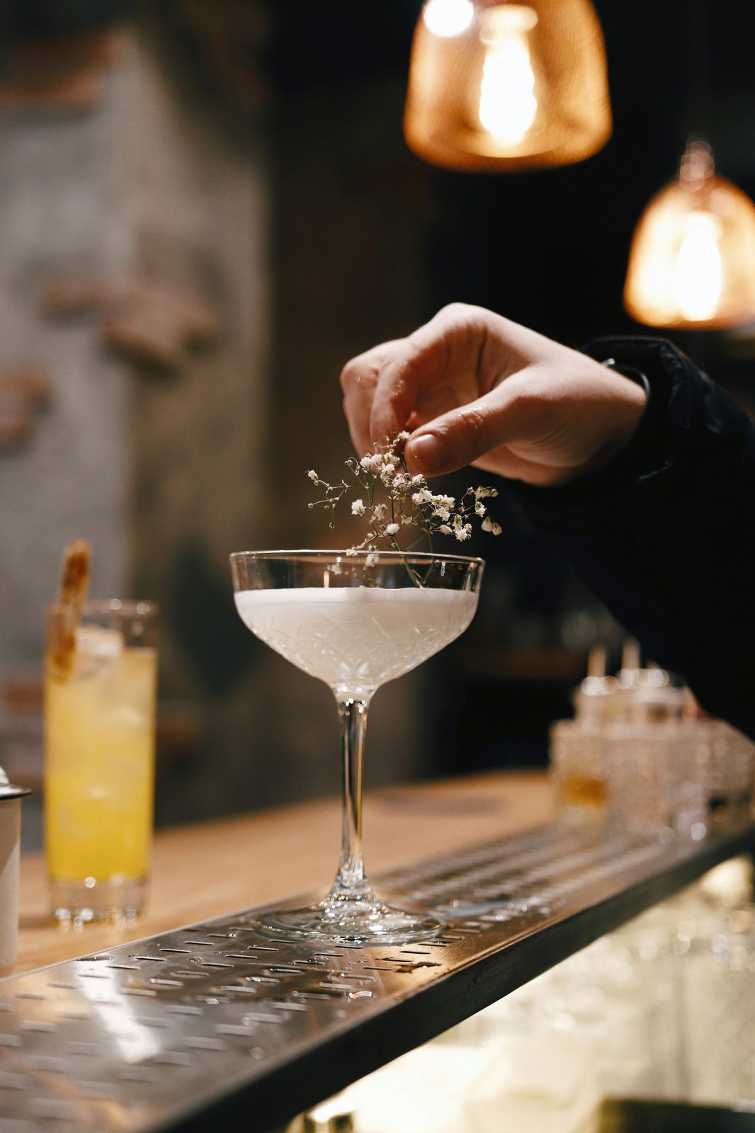 Judges scoring cocktails with a live leaderboard visible