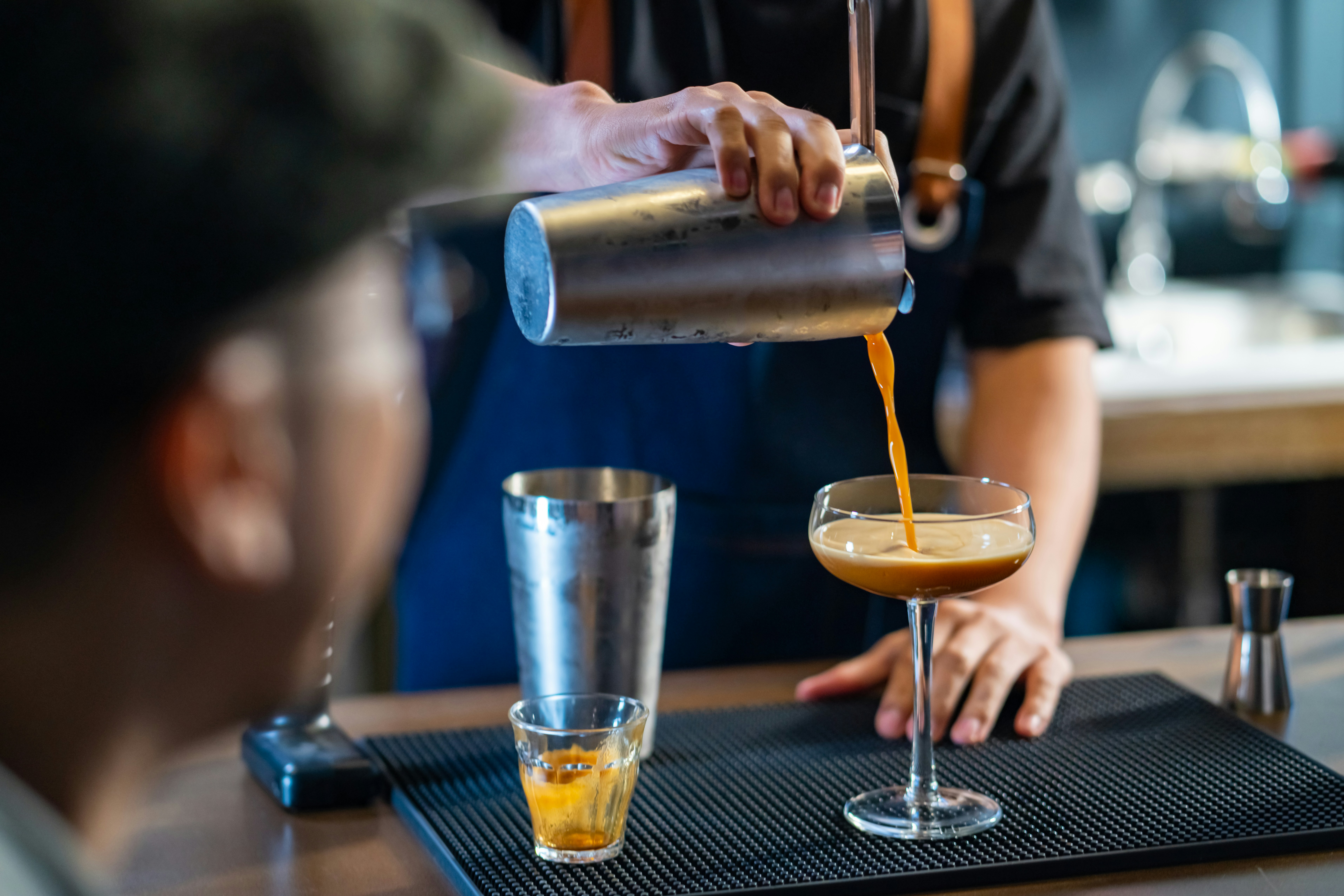 Bartender pouring an espresso martini
